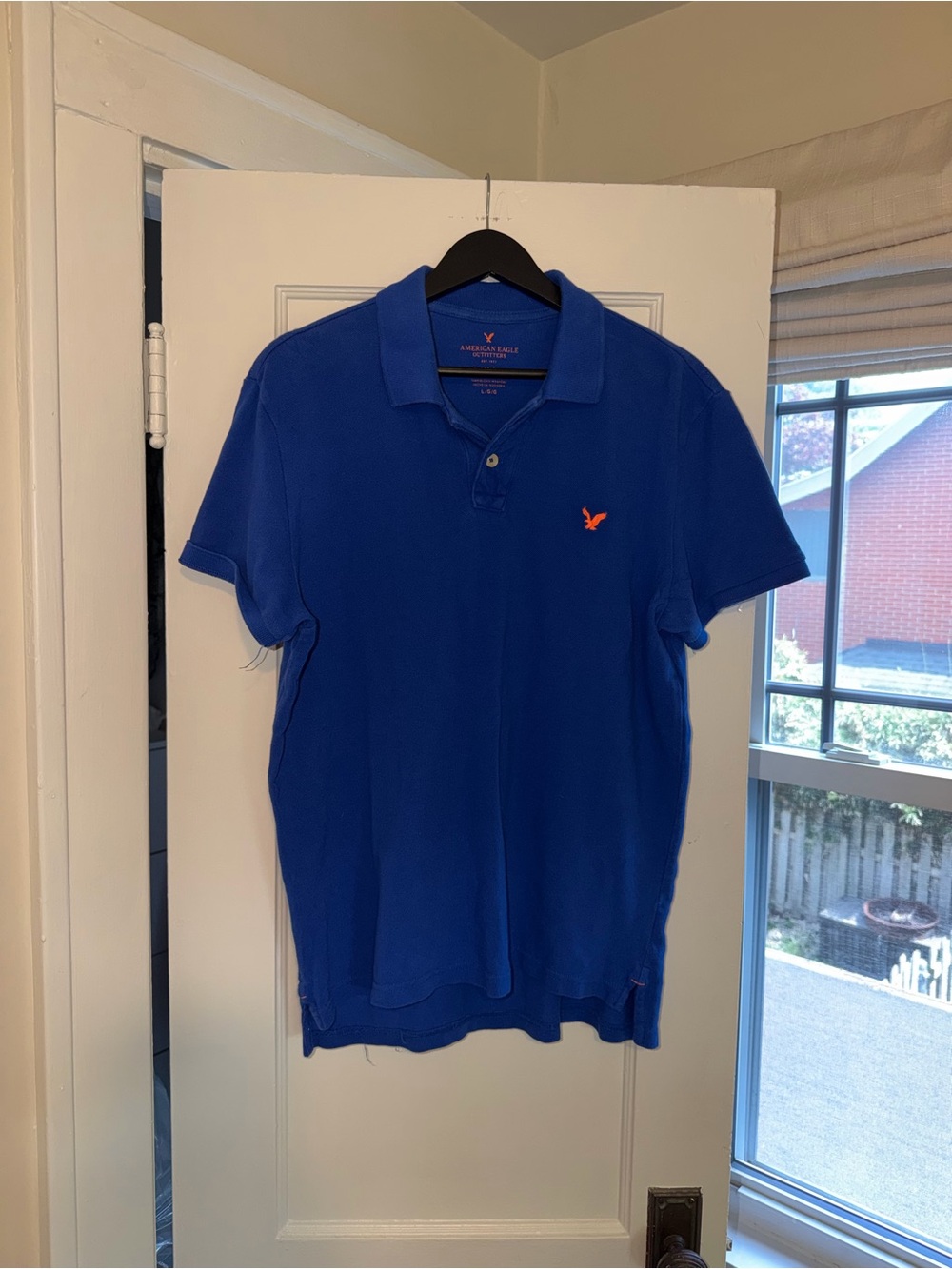 American Eagle Outfitters Men’s Royal Blue Polo with Orange Logo